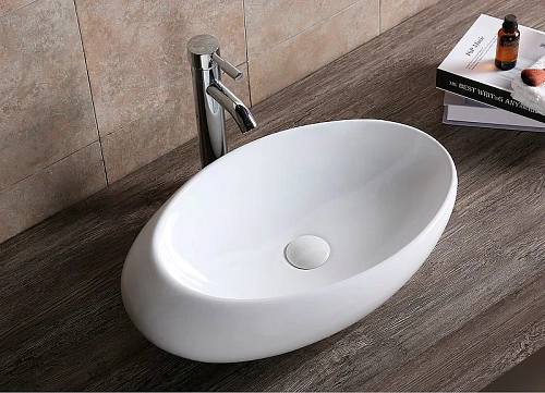 Раковина Ceruttispa CR0058B 580х370х140 накладная, белая, смещенный овал Раковина Ceruttispa CR0058B 580х370х140 накладная, белая, смещенный овал