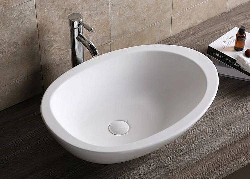 Раковина Ceruttispa CR1005 660х485х160 накладная, белая, асимметричный овал Раковина Ceruttispa CR1005 660х485х160 накладная, белая, асимметричный овал